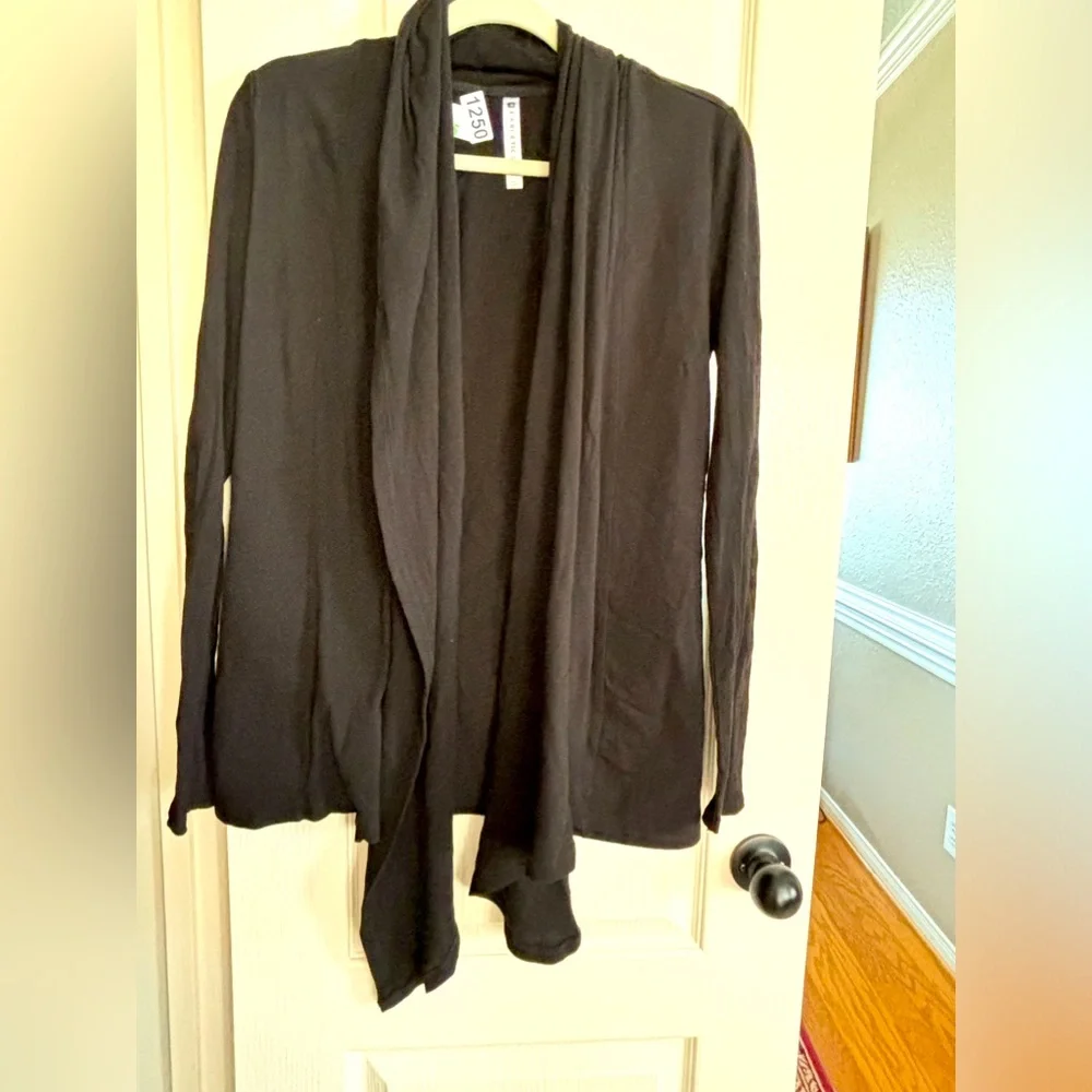 Fabletics wrap type cardigan. Size CS would for sure fit S and probably a medium